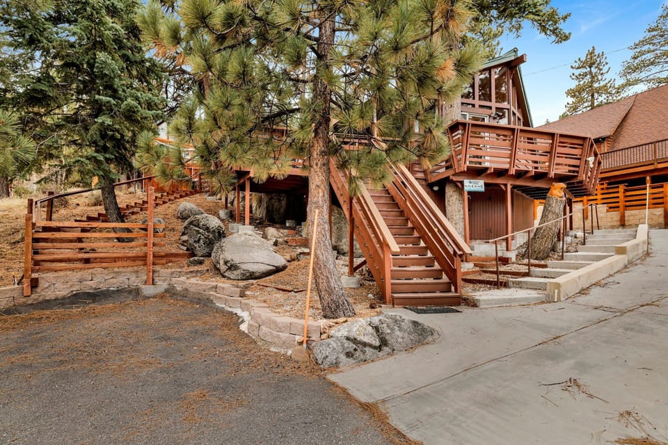 Arrive with ease using the private driveway, located just steps from the front door. Please note that the main entrance is accessed via exterior stairs, adding to the classic mountain-cabin feel.