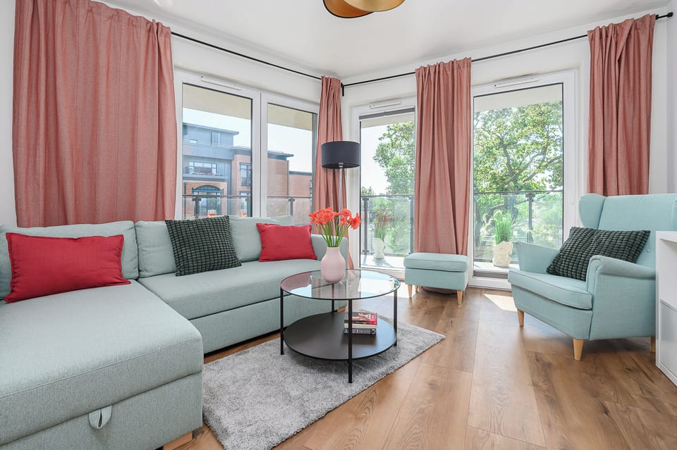Comfort Apartment | Living area | 50-inch Smart TV with cable channels