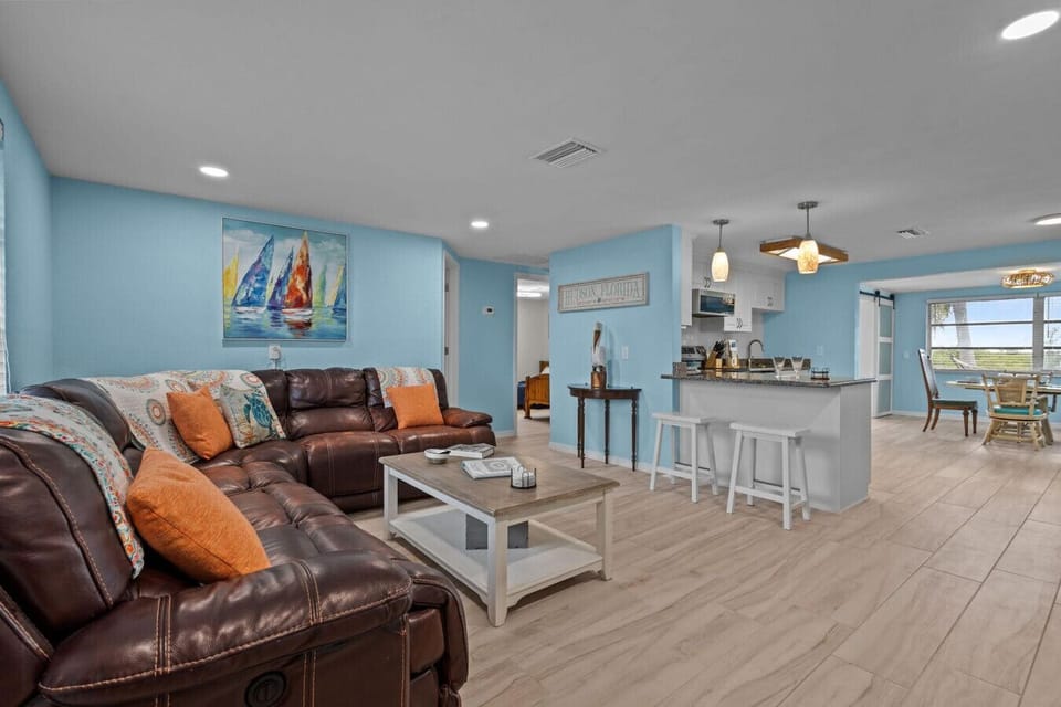 Open-concept living connects the comfy lounge area to the modern kitchen and dining, keeping everyone together.