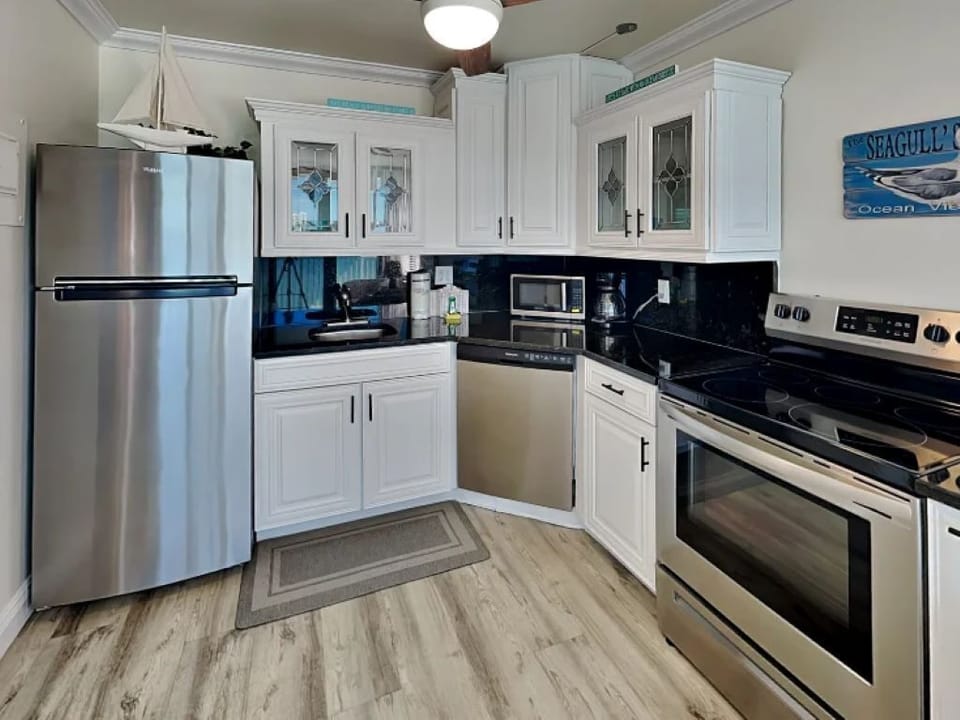 Kitchen With Refrigerator, Dishwash & Stove
 