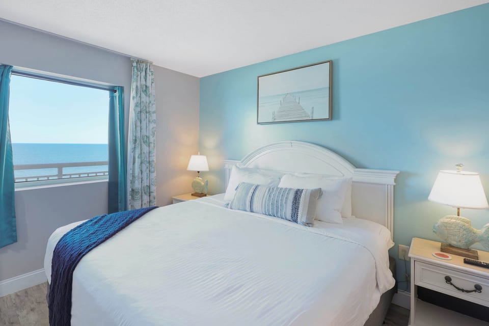 Wake up to endless ocean views right from your bed! This beachfront bedroom offers the perfect blend of comfort, charm, and coastal beauty—ideal for your Myrtle Beach escape.
