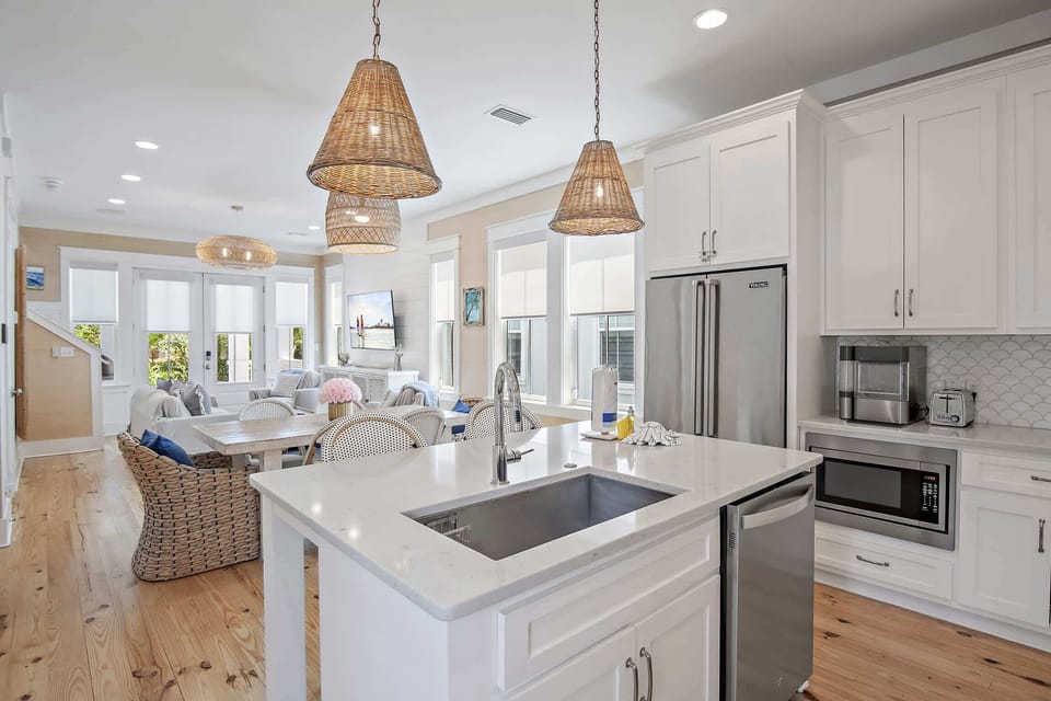 A chef's kitchen flows into the dining and living areas for effortless entertaining.