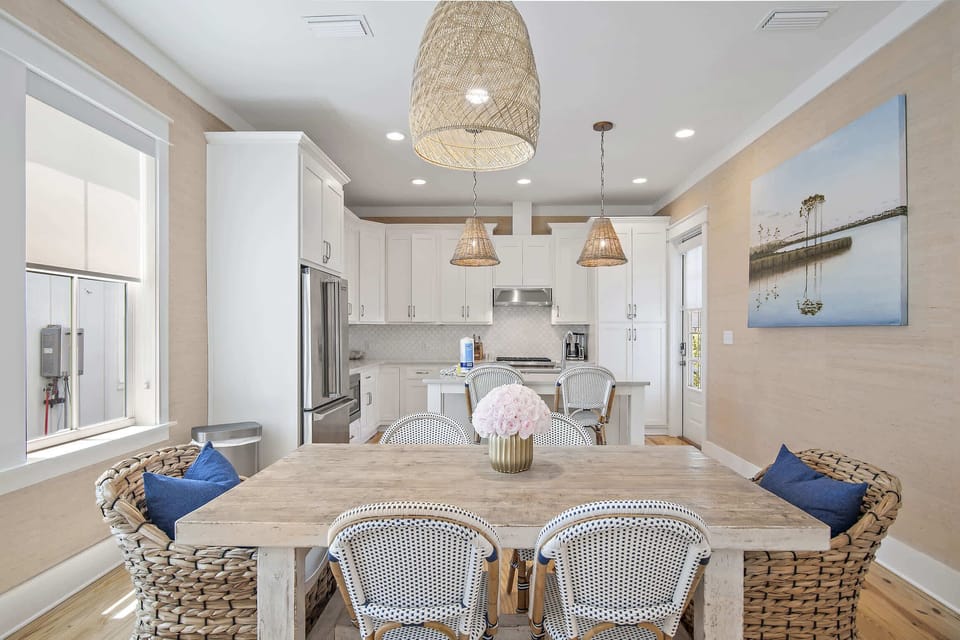 Share meals in a light-filled dining area open to the kitchen.