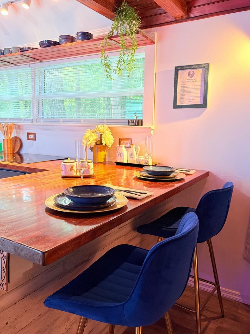 Cozy breakfast bar with elegant tableware and forest views.