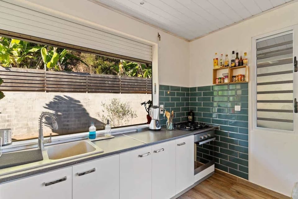 Sleek counters, storage, and sunshine all day.