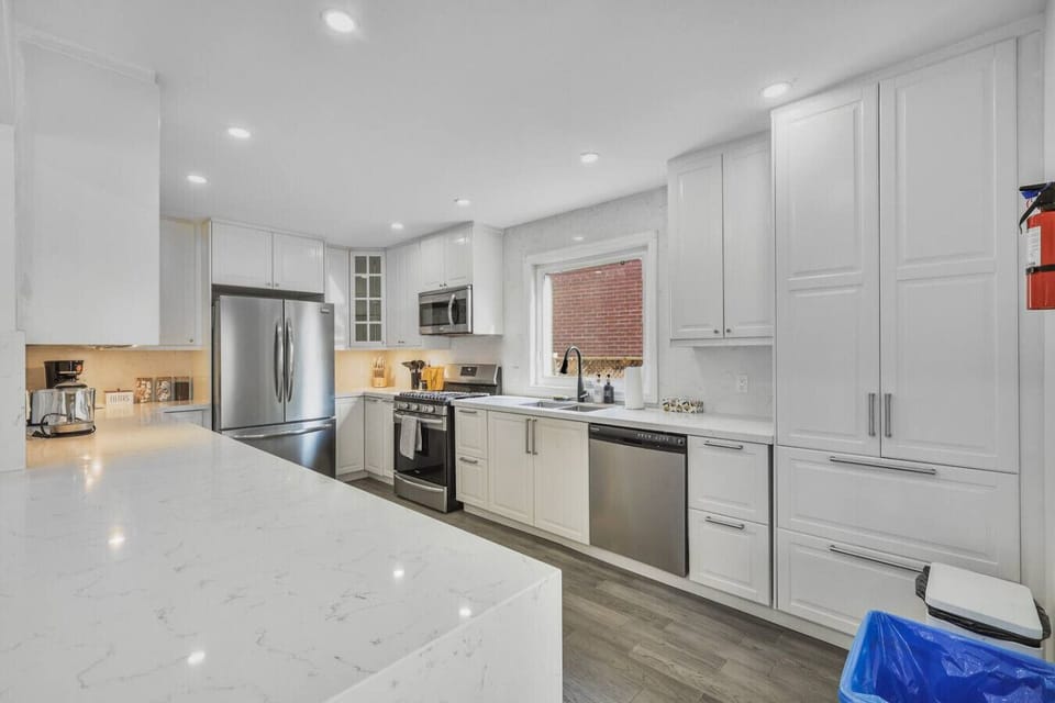 right, modern, and ready for your next meal. This sleek kitchen blends function with style, featuring marble-inspired counters, stainless appliances, and a welcoming open layout perfect for cooking and connection.