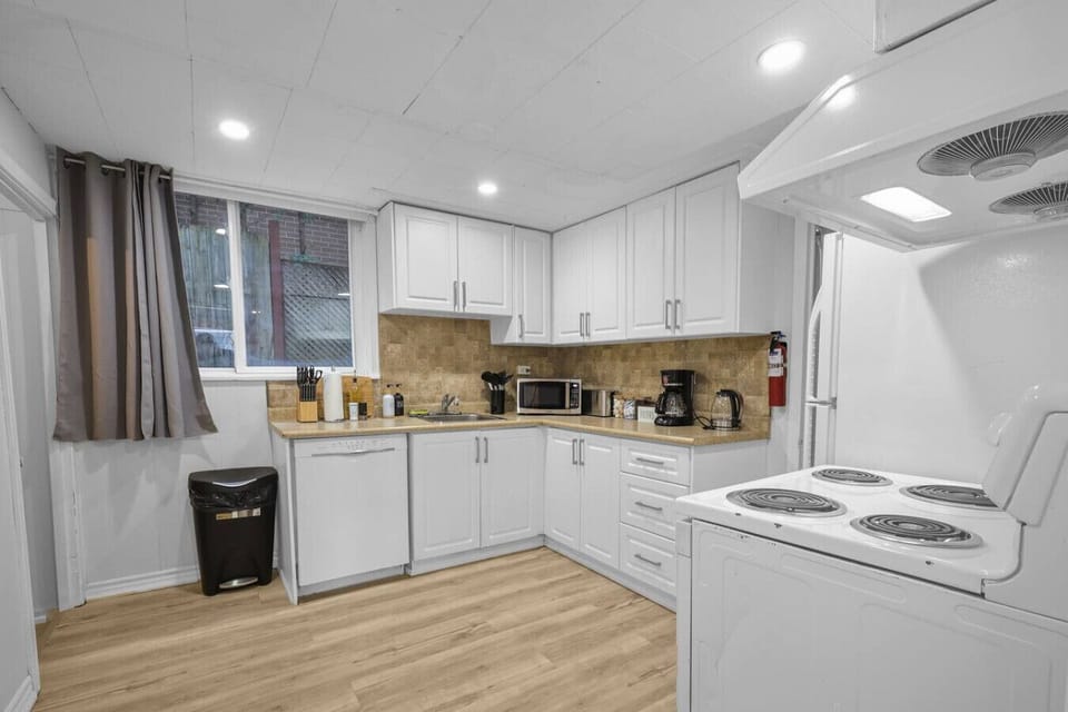 Private kitchenette equipped with a full sink, microwave, toaster, and coffee maker. Enjoy the convenience of making your favorite meals during your stay.