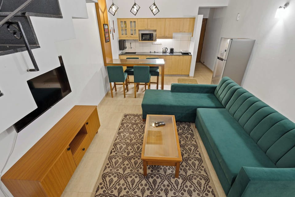 Luxury Condo, 2 Bedrooms, Pool View | Living area | 50-inch LED TV with digital channels, Netflix, streaming services