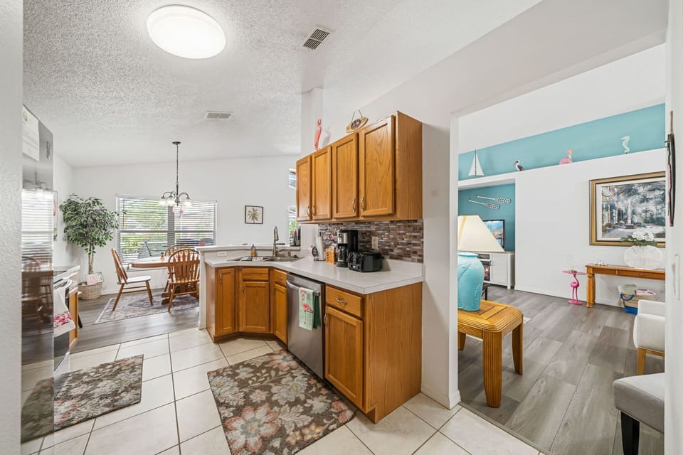 Open kitchen with cookware, utensils, and plenty of space for group dining