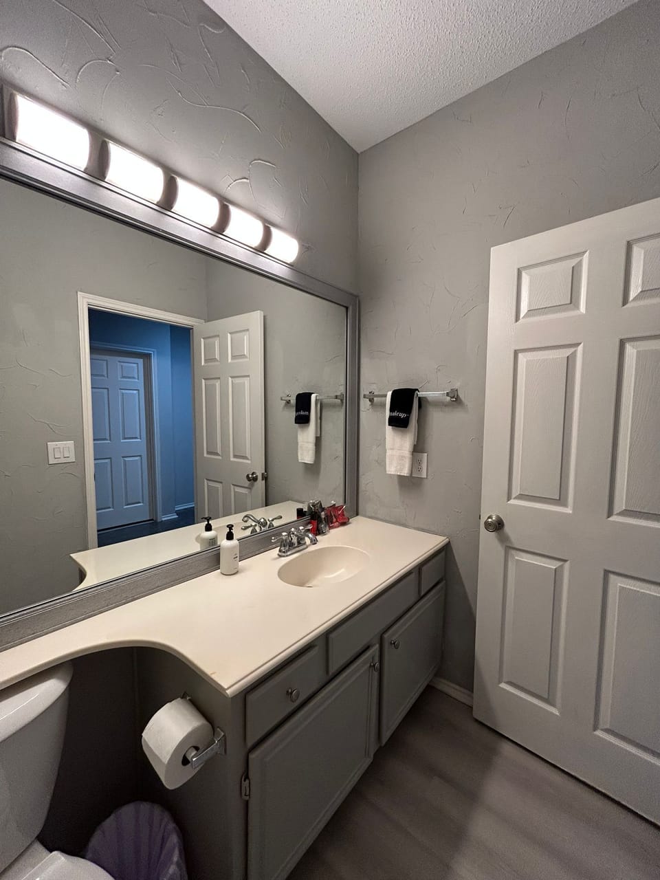 Clean, simple bathroom with thoughtful touches.