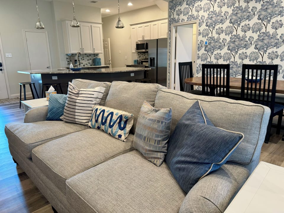 Comfy seating and curated pillows with a pop of lake inspired blue.  