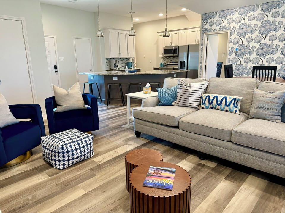 Spacious main living area with natural light and stylish design touches  