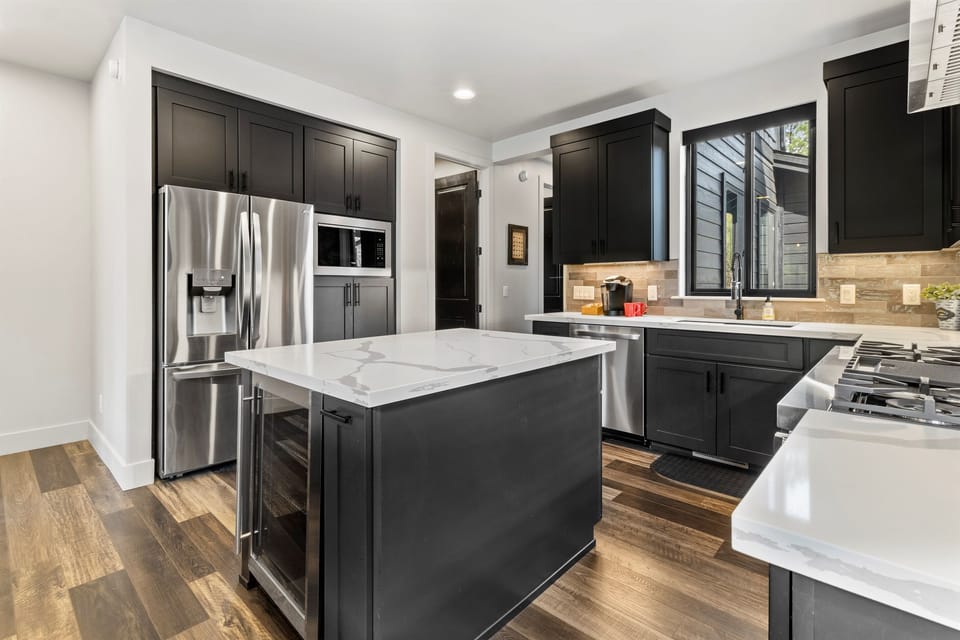 Chef’s kitchen with high-end appliances, granite counters, and all the tools you need to cook and gather.