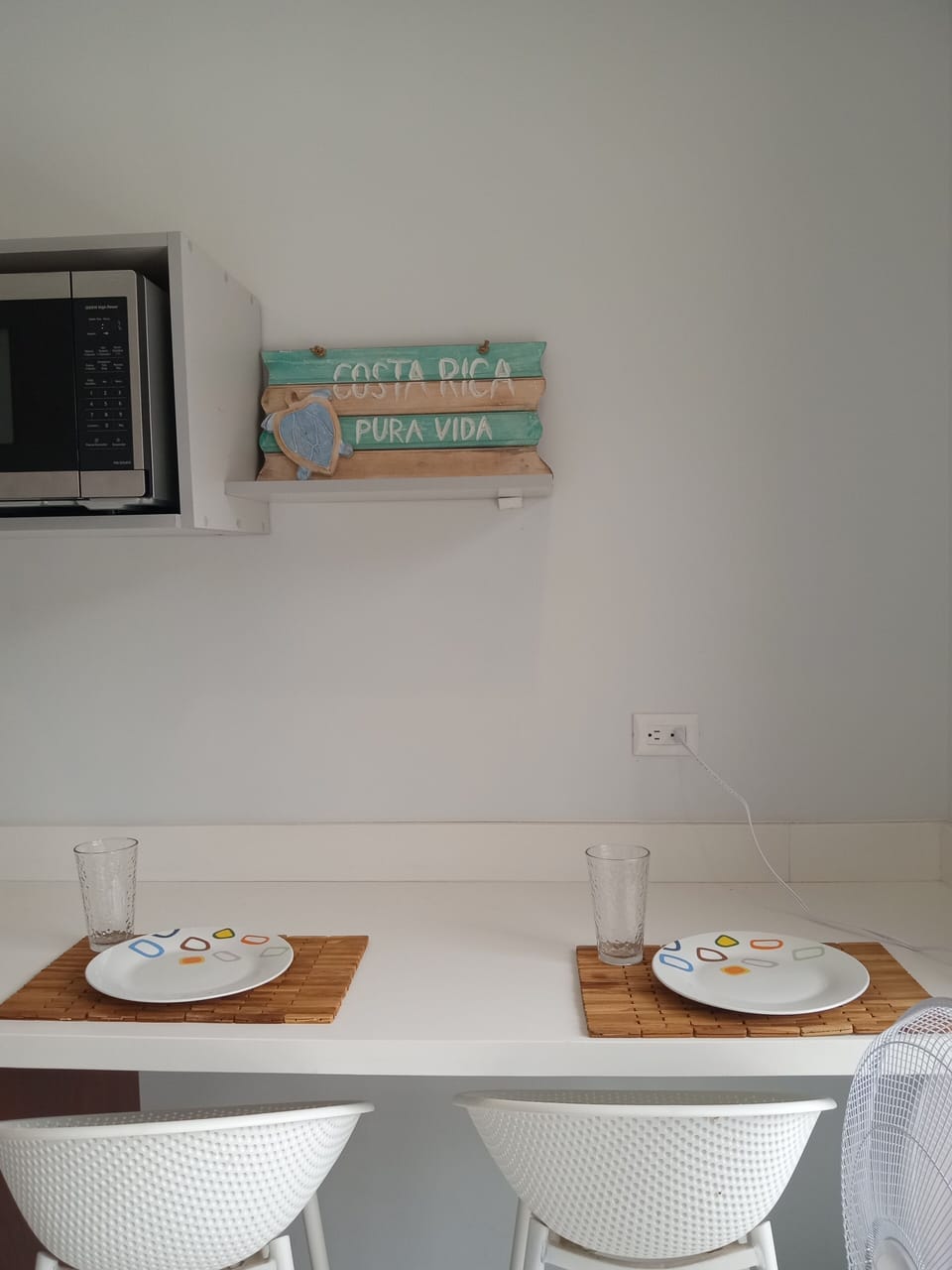 Dishes, cutlery, kitchen linens, cooking utensils, double electric cooktop