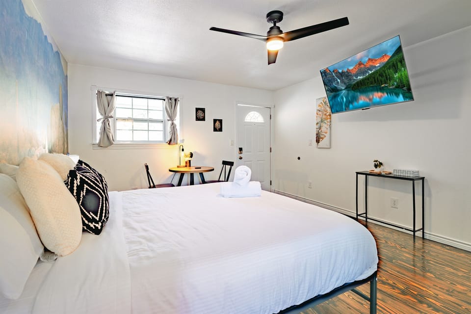 The bed is elegantly appointed, providing a serene haven after a day of exploration.