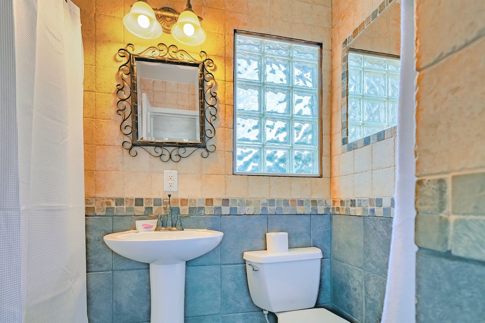 The bright, spa-style bathroom offers a refreshing place to begin or end your day.
