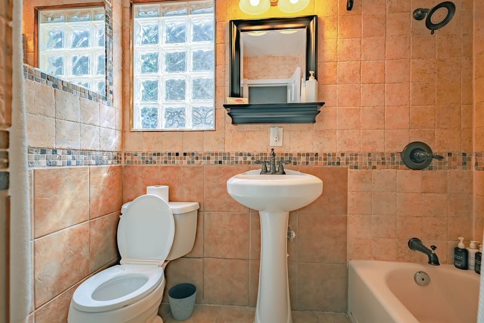 The bathroom’s clean, modern design offers a refreshing space to begin or end each day.