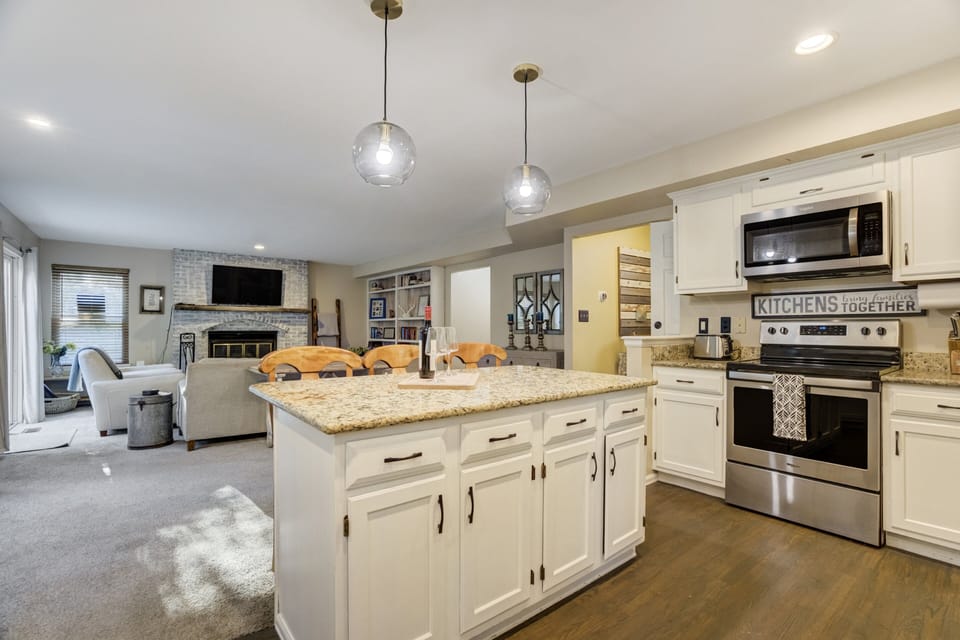 Beautifully updated kitchen with modern finishes and a seamless view into the living room so you can cook while staying connected.