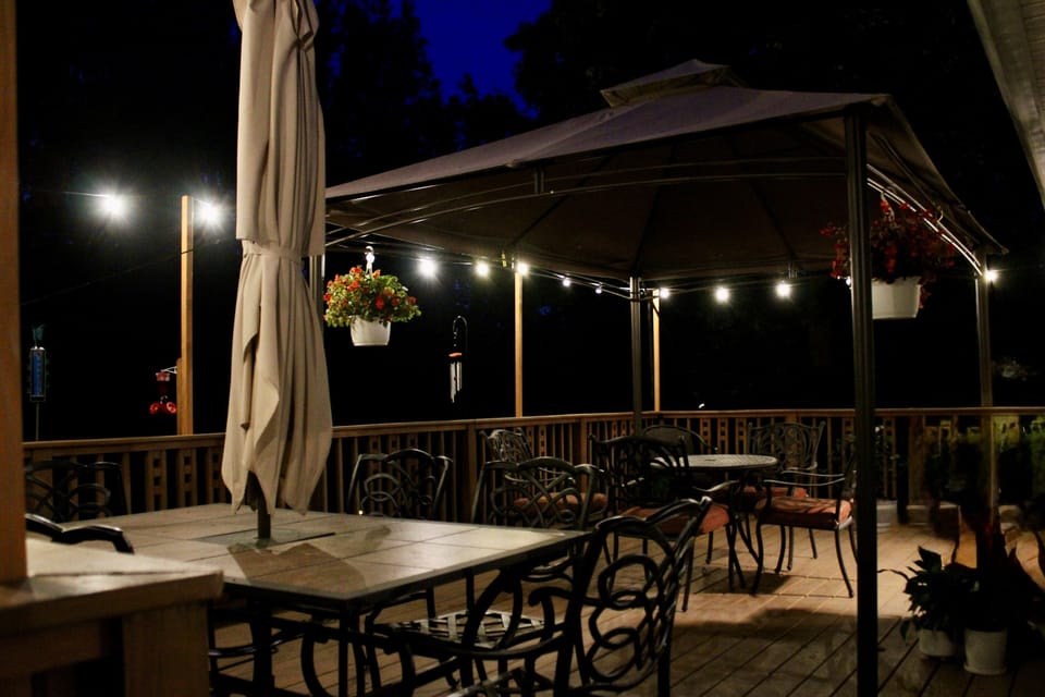 Relax- you are on vacation after all! The elevated deck perfectly looks over the private, spacious backyard. Turn on the edison lights to make your experience extra special! 