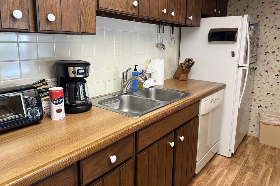 Our kitchen features ample cabinetry and all the essentials for a gourmet vacation meal.