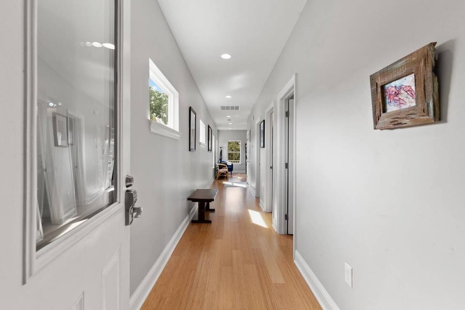 Bright hallway leading to the bedrooms — clean, open & easy to navigate.
