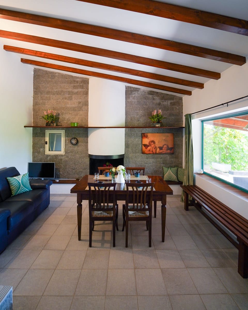 Quadruple Room, Garden View | Living area | 27-inch LCD TV with digital channels