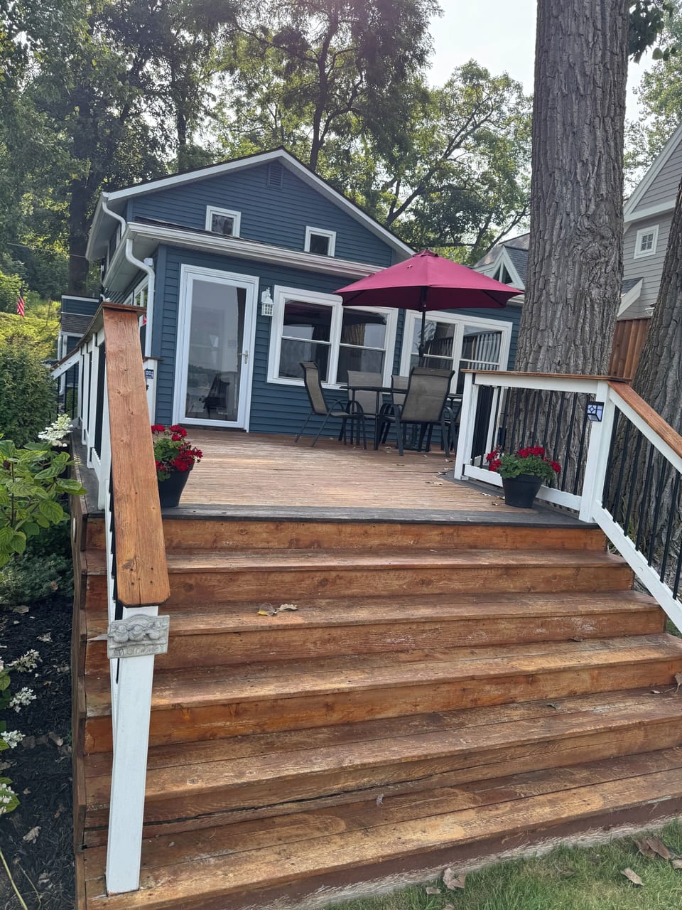 Large deck with patio set and grill