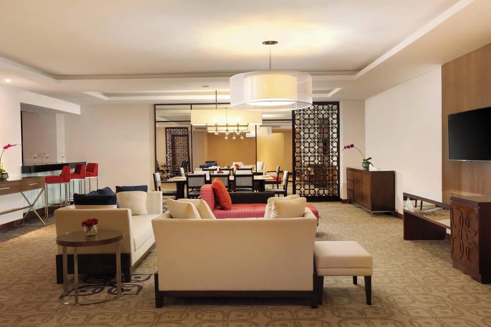 Presidential Suite, 2 Bedrooms, City View | Living room | 48-inch LED TV with satellite channels, TV