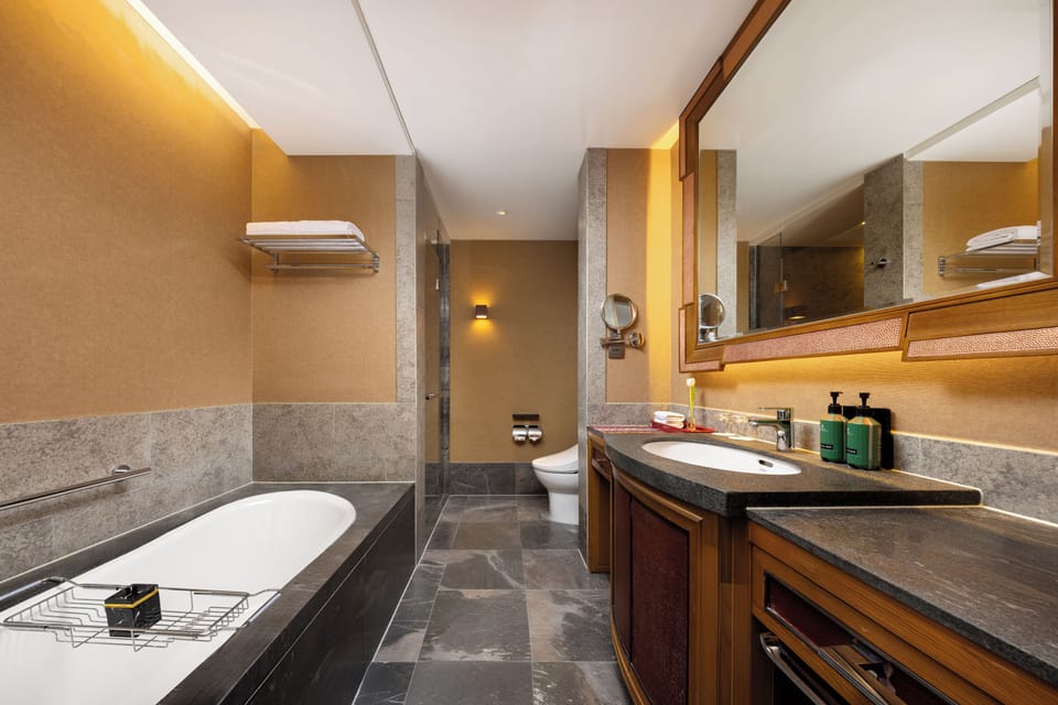 Separate tub and shower, rainfall showerhead, designer toiletries