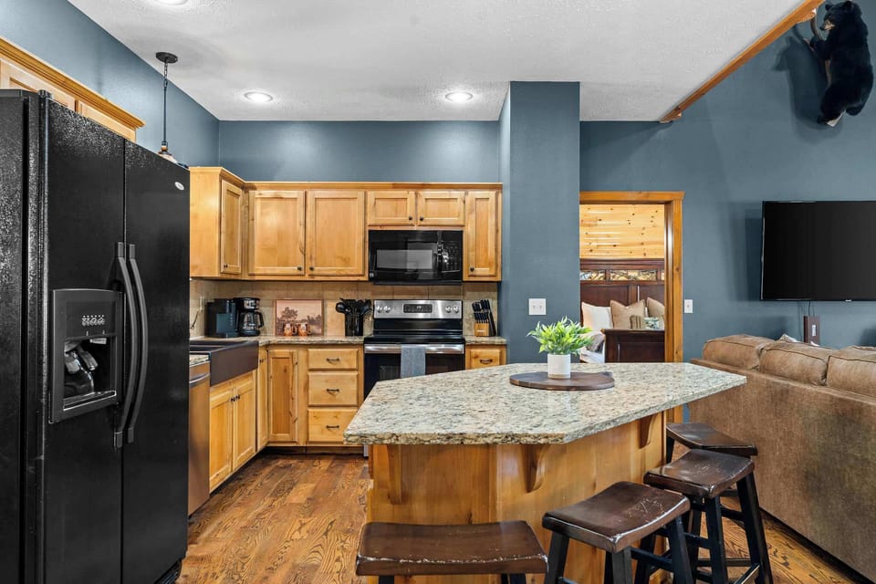 Open concept kitchen allows you to still be a part of the fun when duty calls.