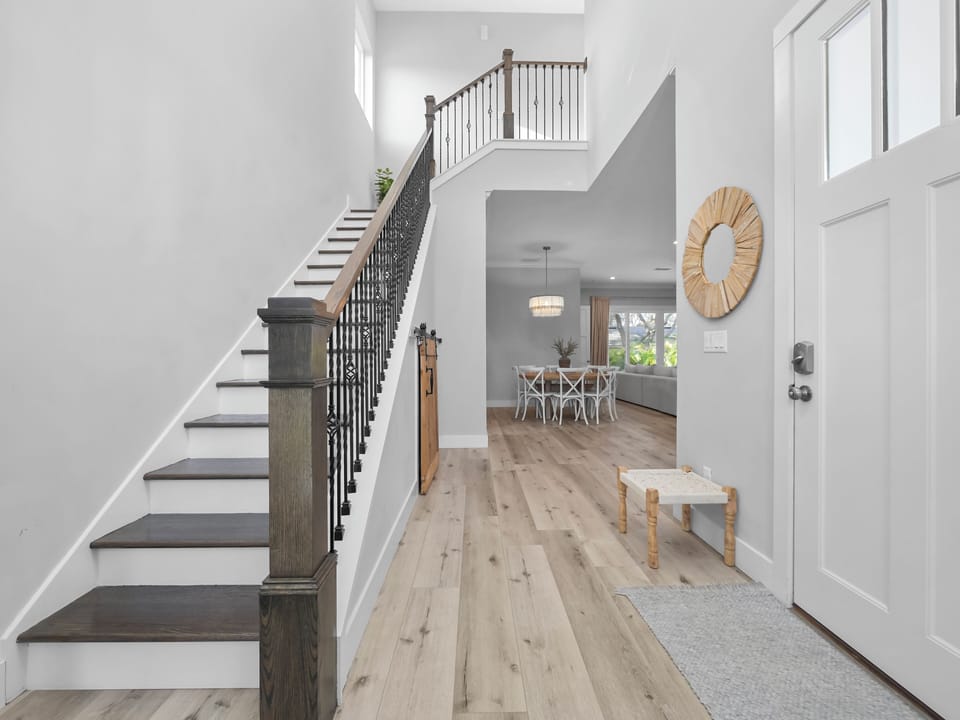 Step through the front door into an open, airy floor plan, with the main living spaces below and three bedrooms tucked upstairs for comfort and privacy.