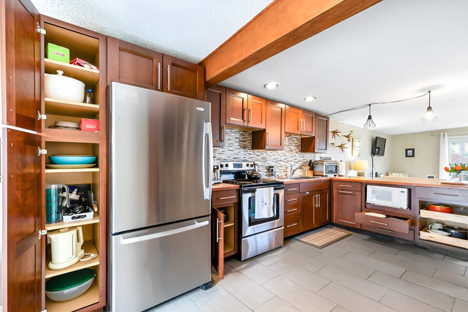Sizeable fridge for longer stays. Notice the cooking supplies. Comes with pots and pans, utensils, plates, bowls, cups, etc.