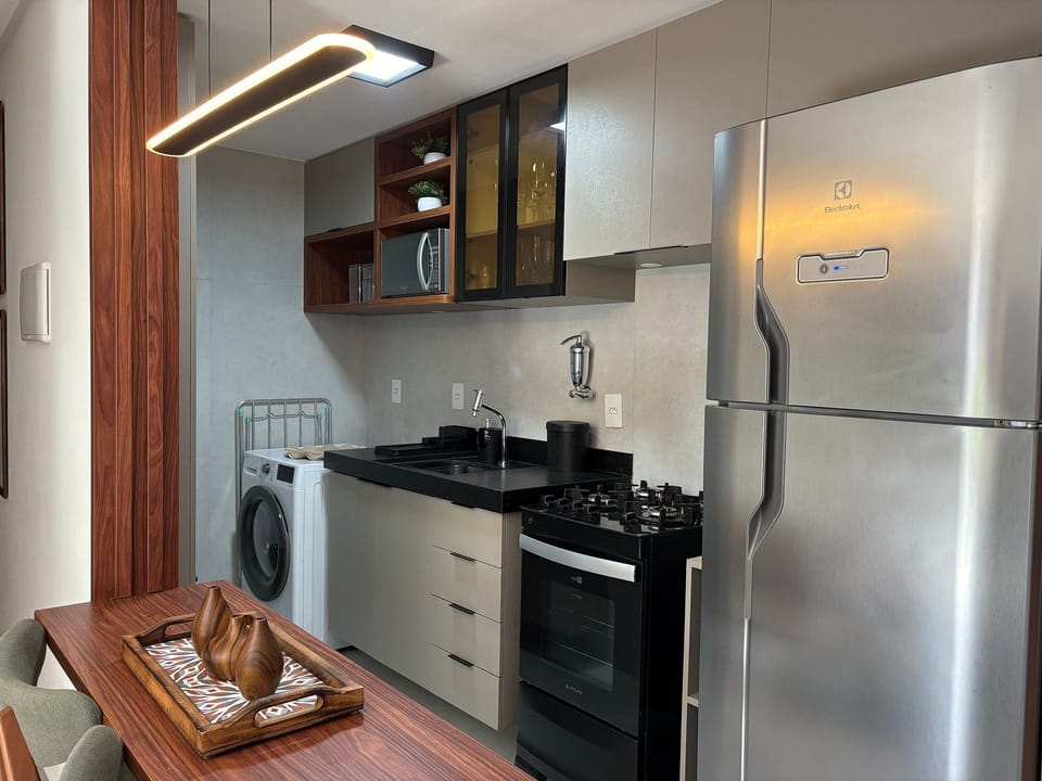 Basic Apartment | Private kitchen | Toaster, cookware/dishes/utensils, dining table