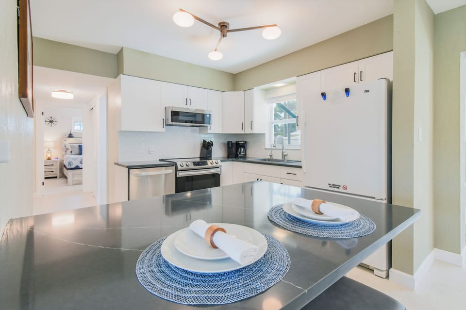 Fully stocked kitchen with all of your cooking needs plus 2 seats at the island