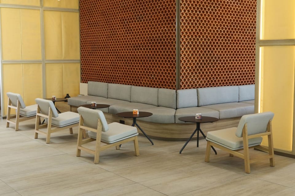 Gather comfortably on plush seating with intimate tables nearby.