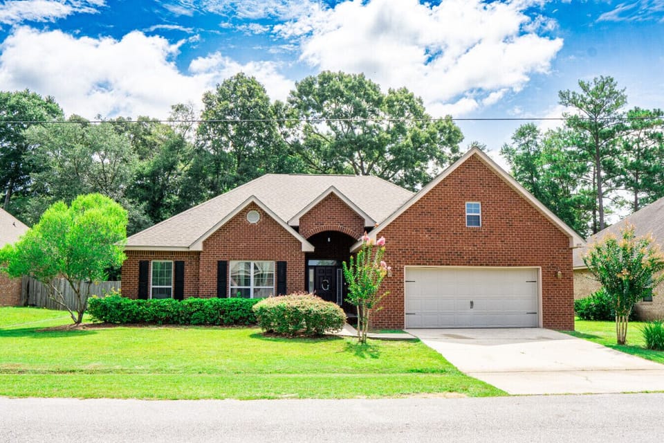 Charming Brick Exterior | Attached Garage & Well-Maintained Landscaping