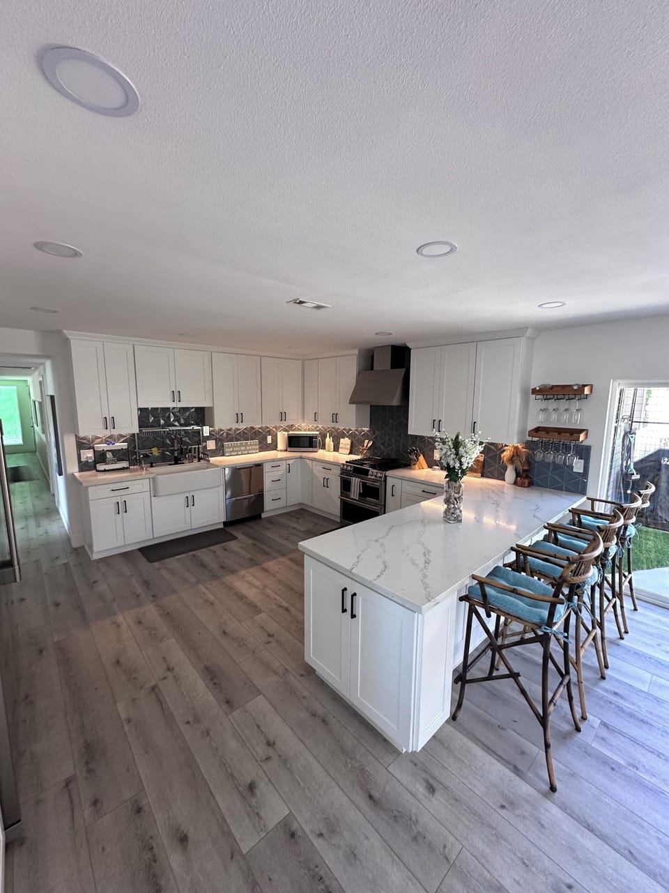 Kitchen with doors to backyard dog pen.