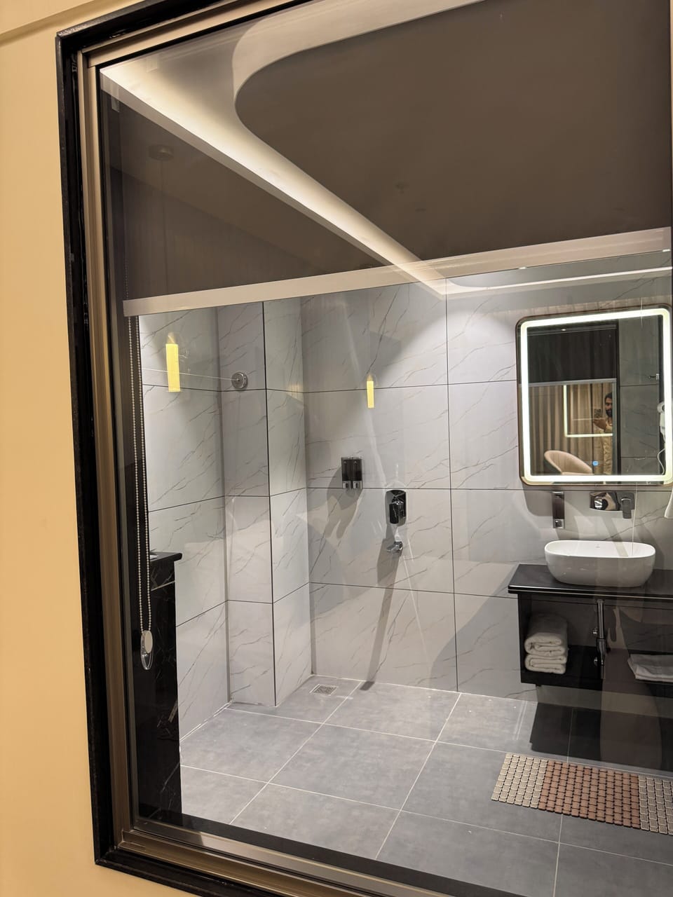 Shower, hair dryer, slippers, towels