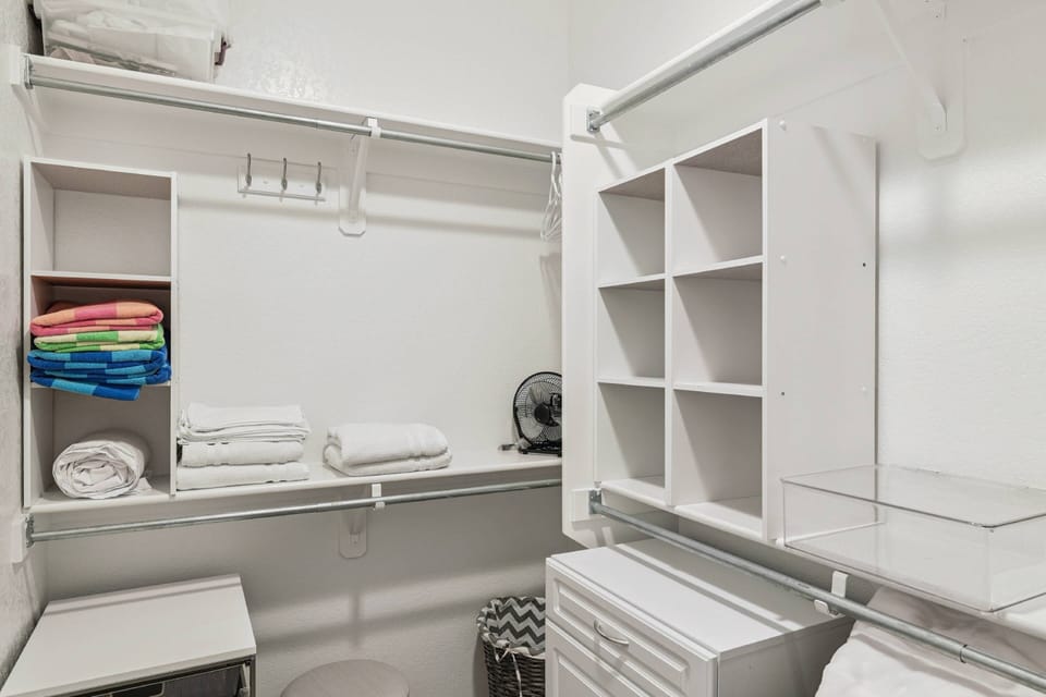 Master walk in closet located in the master bathroom