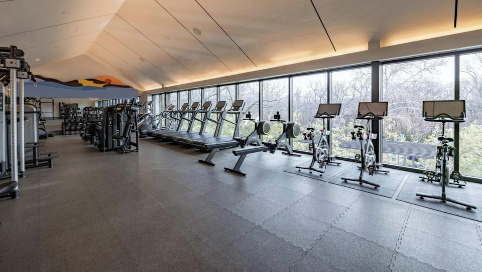 Guests can upgrade their stay to get access to Blake Street. Amenities include a full-service restaurant, craft cocktail bar, hot tub, sauna, cold plunge, swimming pool, and a top-tier fitness center. See listing description for details.
