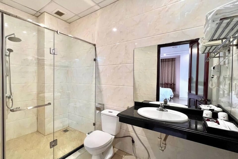Shower, free toiletries, hair dryer, slippers