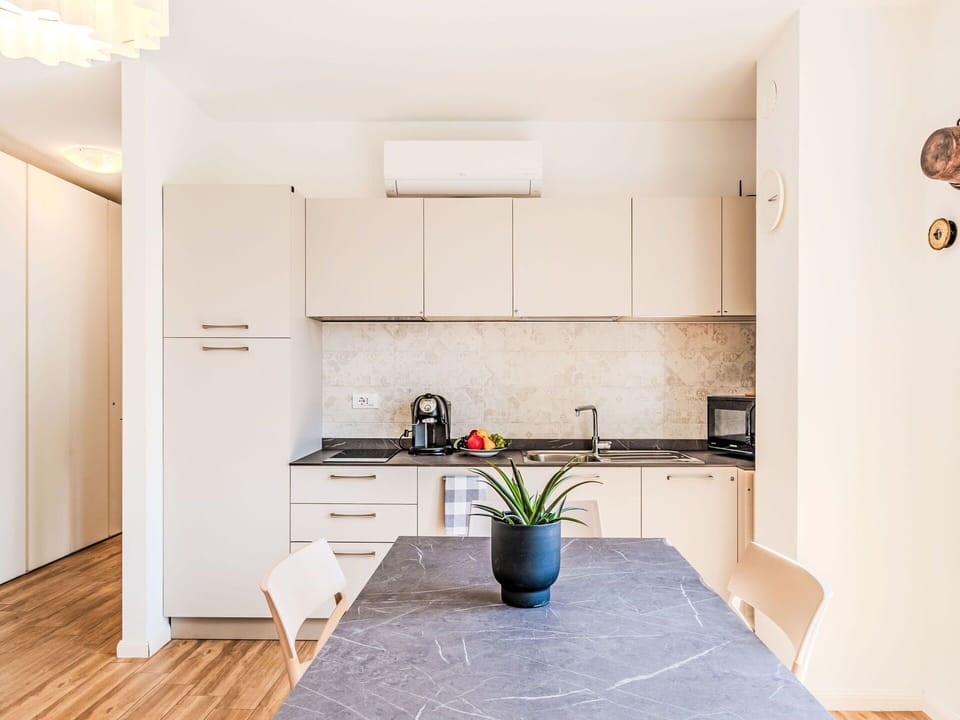 Furniture, Interior Design, Kitchen, Flooring, Countertop, Wood, Kitchen Appliance, Floor, Kitchen & Dining Room Table, Wood Flooring