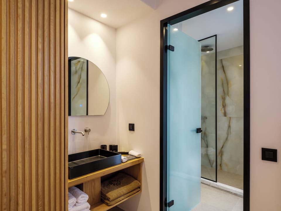 Luxury Duplex, Patio, Lake View | Bathroom | Hair dryer, slippers, towels, soap