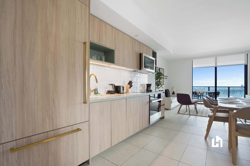 Cook and connect in this open-concept kitchen with city views beyond.