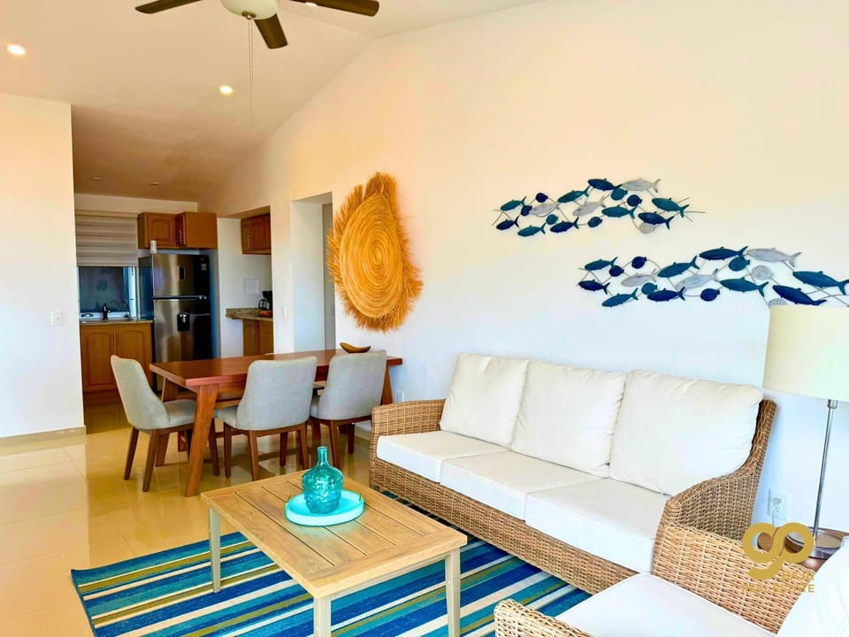 A sofa and wall-mounted Smart TV
