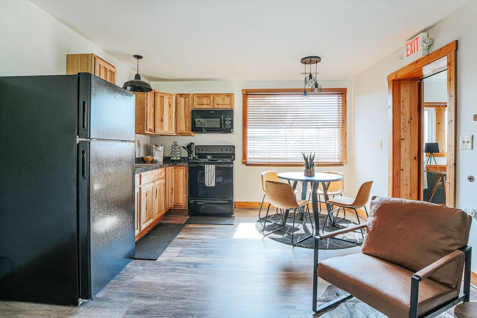 The fully-equipped kitchen offers a seamless blend of comfort and functionality, complete with stainless steel appliances, perfect for whipping up delicious meals to enjoy at the cozy dining nook.