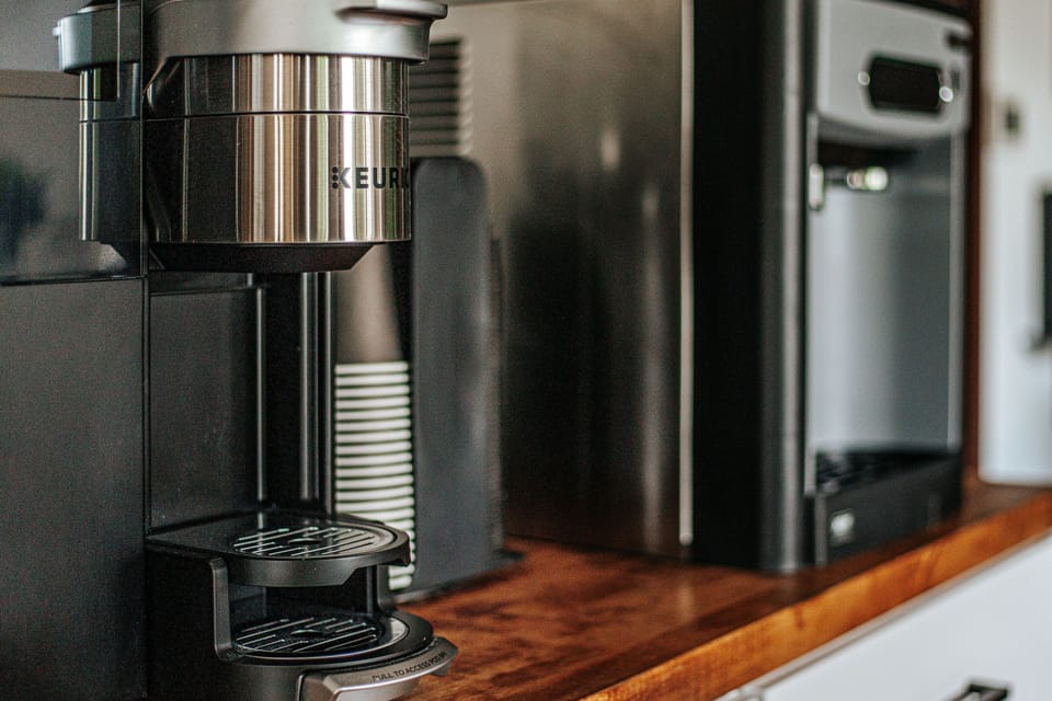 Coffee maker and supplies ready for your morning brew.