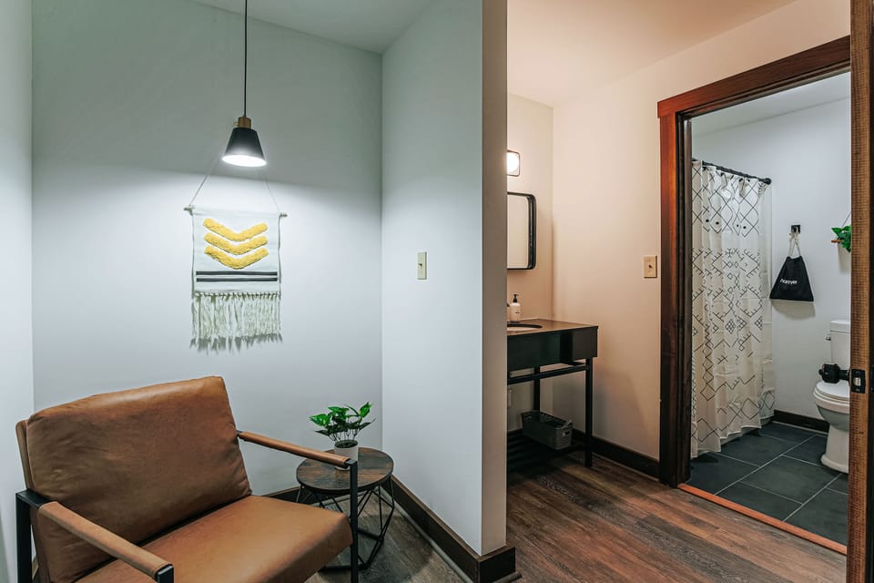 Relax in a stylish ensuite bath, designed for convenience and tranquility.