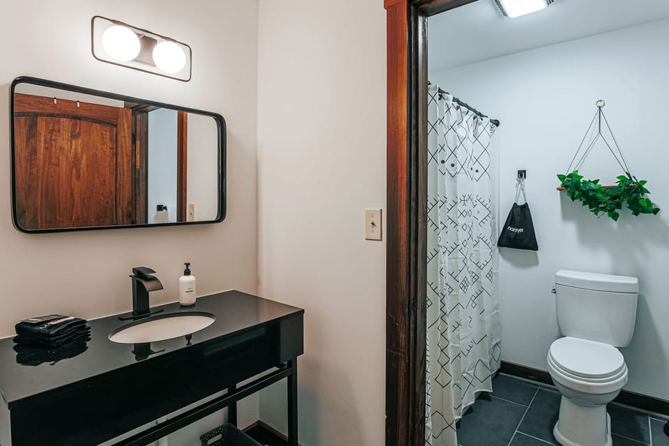 Modern finishes complement the cleanliness of a chic bathroom space.