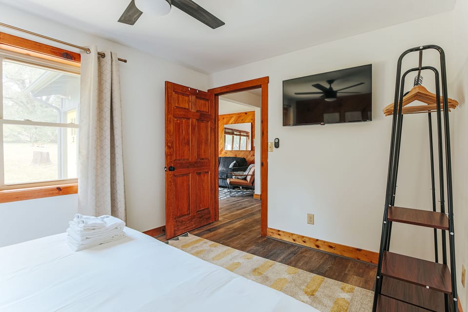 The bedroom also features a smart TV and easy living area access.